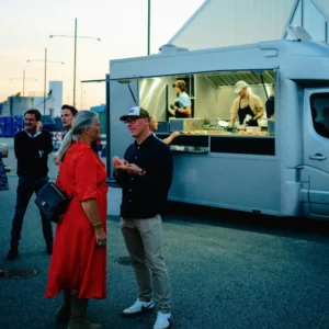 Food trucks serving at a summer party
