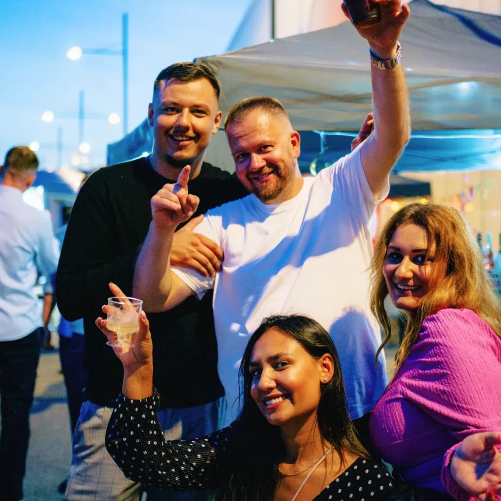 Ice cold drinks and delicious cocktails - Happy guests at a festival-themed summer party