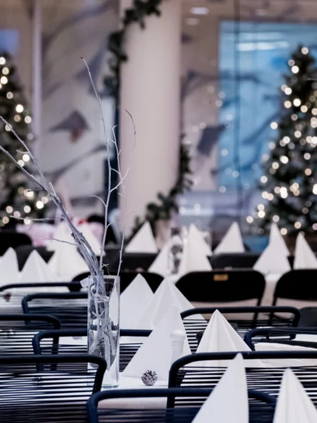 Table setting and event styling for a company Christmas party with a winter wonderland theme